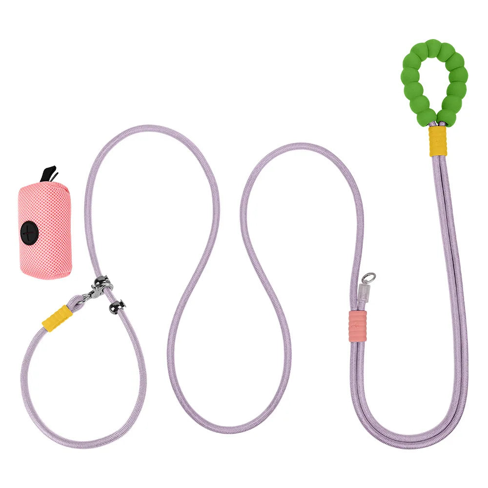 A blossom pink reflective elastic buffer dog leash bundle showing its lightweight high-density woven nylon structure and matching pet waste bag pouch.