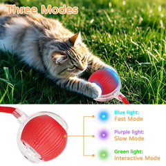 A red smart interactive tail ball rolling on the floor with its faux tail fluttering, enticing a pet.