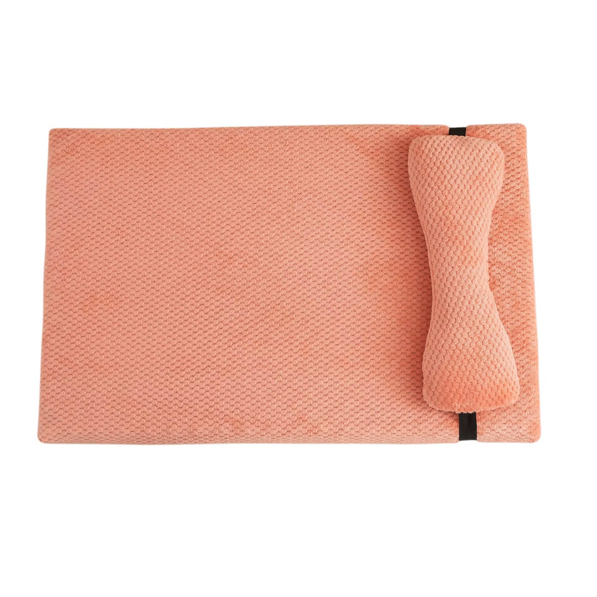 Large soft pink corduroy dog bed with a plush integrated pillow for anxiety relief.