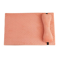 Large soft pink corduroy dog bed with a plush integrated pillow for anxiety relief.