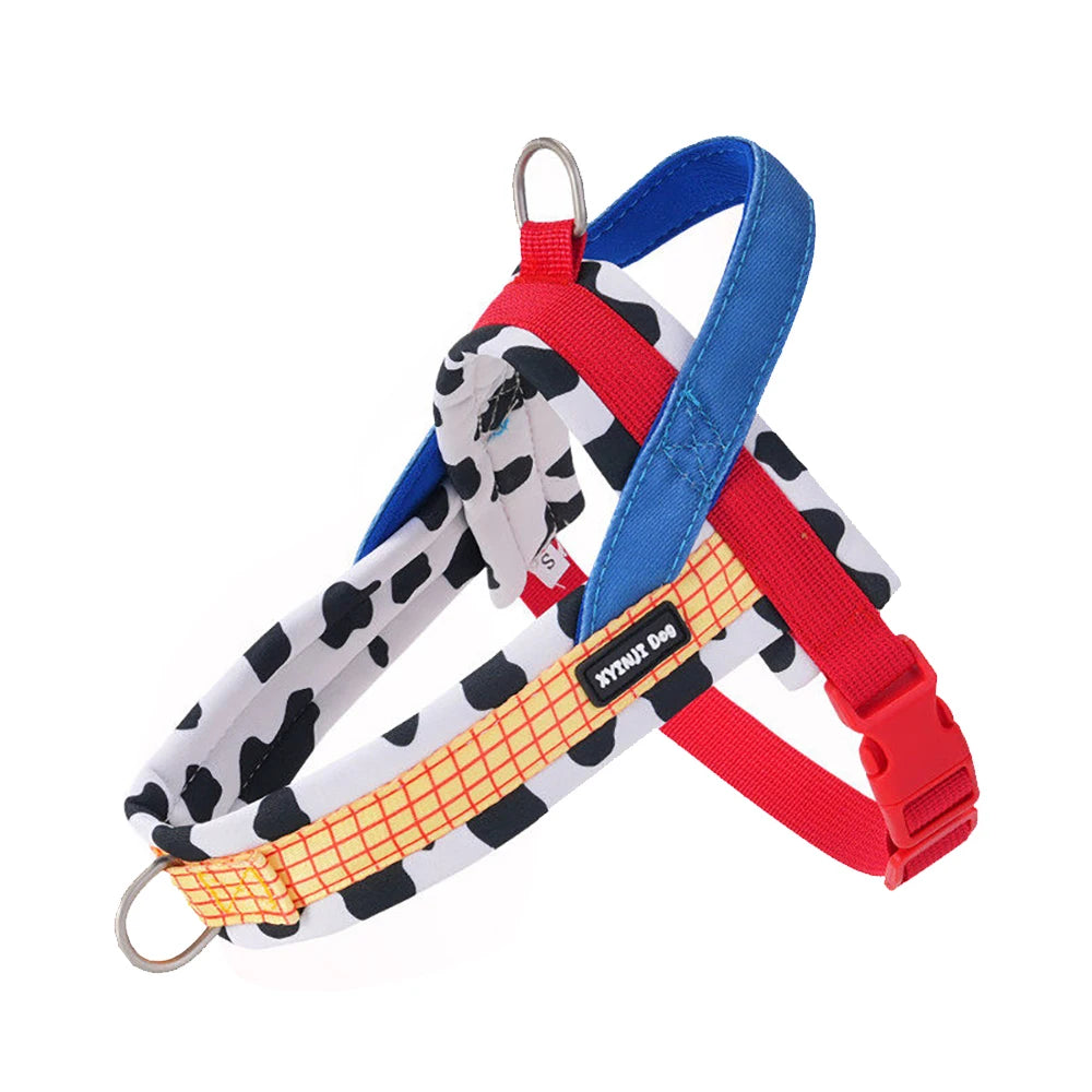 A vibrant step-in pet harness and leash set featuring a cow print lining, an orange grid chest strap, and royal blue accents for small dogs and cats.