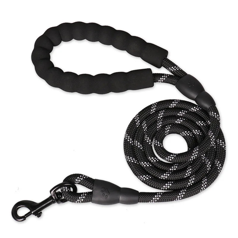 A strong midnight onyx black reinforced nylon dog leash featuring its thick woven webbing structure and soft padded comfort handle.