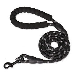 A strong midnight onyx black reinforced nylon dog leash featuring its thick woven webbing structure and soft padded comfort handle.