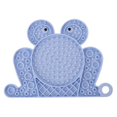 A blue frog-shaped anti-anxiety licking pad made of non-toxic silicone for slow feeding and pet distraction.