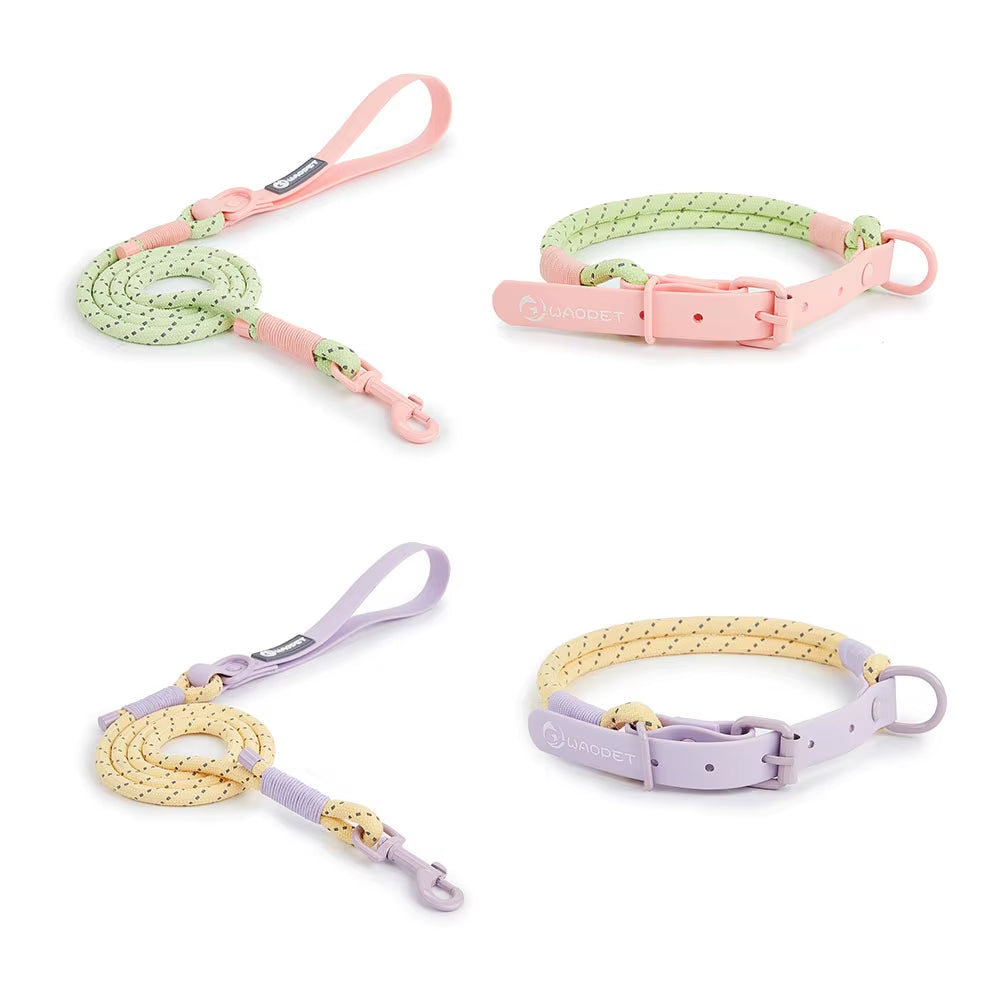 Vibrant pink Biothane loop handle dog walking leash paired with a mint green reflective nylon rope and pink rust-resistant snap hook.