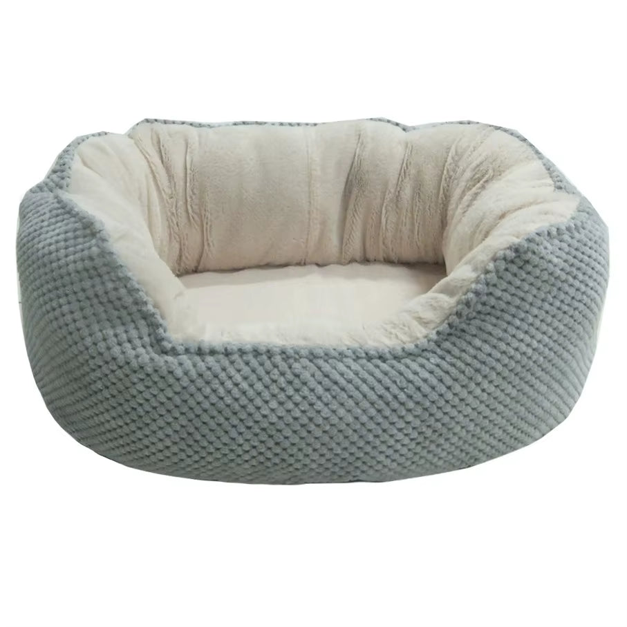Side view of a Wave-Shaped pet bed showing the ergonomic contoured rim and textured bubble fabric.
