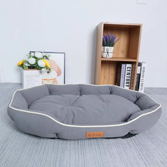 Slate Stone gray rectangular pet sleeping mat and sofa with thick white piping and ergonomic support.